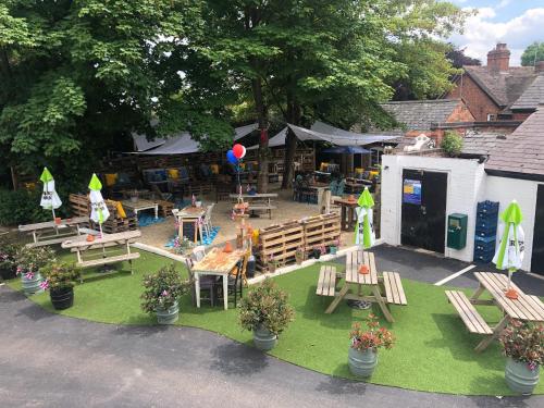 an aerial view of a park with benches and tables at The White Lion Inn in Hampton in Arden