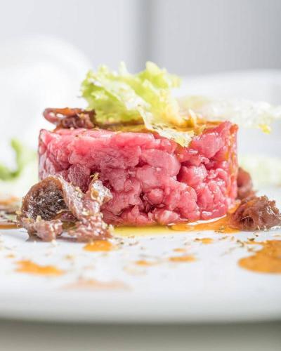 a piece of food sitting on a white plate at Pianderna Agriwellness in Scandiano
