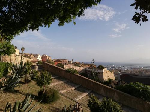 a view of a city from a hill with buildings at B&B San Gregorio SINNAI in San Gregorio