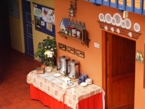 a table in a room with a table cloth on it at Hotel Posada del Angel in Cuenca