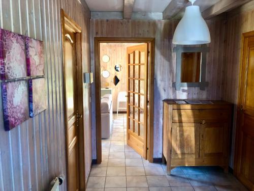 a kitchen with a hallway with a door to a bathroom at House Tayhomen Durbuy in Durbuy