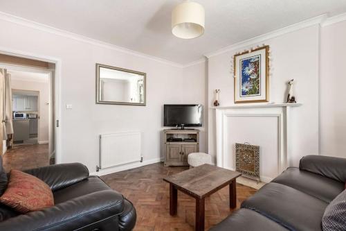 a living room with a couch and a table at The Old Gasworks in Milverton