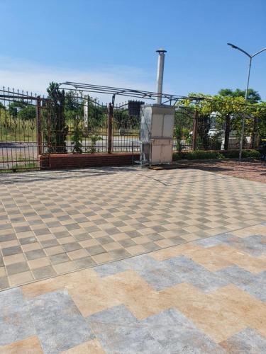 a tile patio with a fence and a gate at Casa Roua in Venus