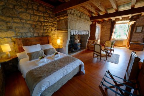 Ένα ή περισσότερα κρεβάτια σε δωμάτιο στο Le petit château du Villard