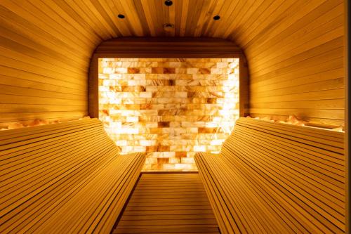 an empty sauna with a brick wall at Hotel Sunce in Soko Banja