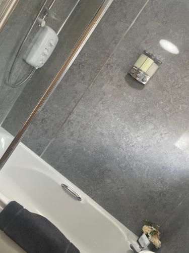 an overhead view of a bathroom with a tub and a sink at Ancaster Apartments in Brumby