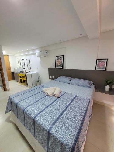 Кровать или кровати в номере Espetacular Apart hotel Manaira