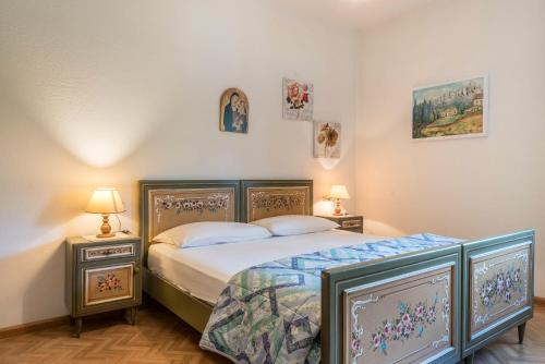 Postel nebo postele na pokoji v ubytování Casa Serena Appartamento Catinaccio