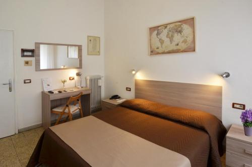 A bed or beds in a room at Hotel La Torre