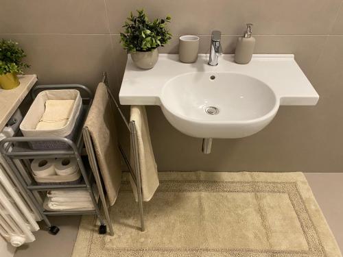 a bathroom with a sink and a white sink at Adream in Pescara
