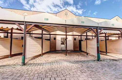 a large white building with a pavilion at Dreamhotel in Appiano Gentile