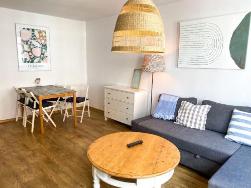 a living room with a couch and a table at Old Town Apartment in Gdańsk