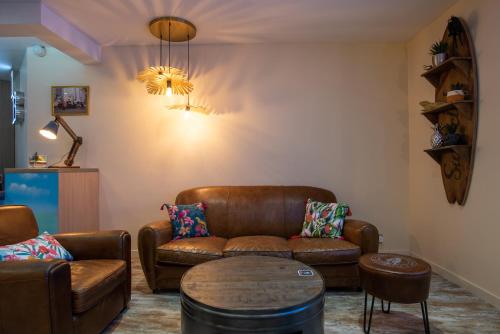 a living room with a couch and a table at Mercure Marseille Centre Vieux Port in Marseille
