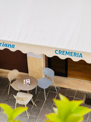 a tent with chairs and a table under it at Adream in Pescara