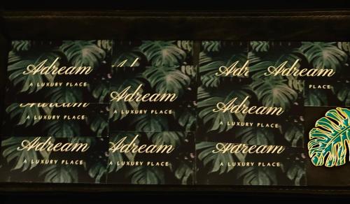 a close up of a shelf of green plants at Adream in Pescara