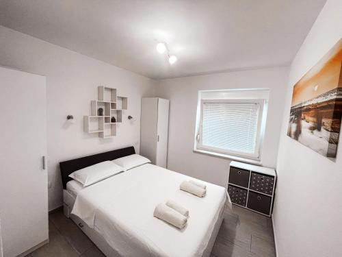Postel nebo postele na pokoji v ubytování RIAD Apartments
