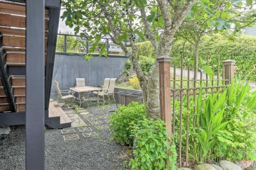 a garden with a fence and a table and chairs at Deck and Sweeping Views Family Union Home in Union