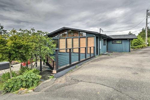 a blue building with a window on a street at Deck and Sweeping Views Family Union Home in Union
