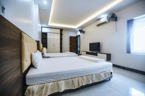 Säng eller sängar i ett rum på Khách sạn Hero Thanh Hóa