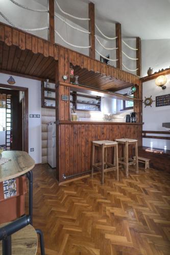 a kitchen with two tables and two bunk beds at Apartman Tina in Grižane