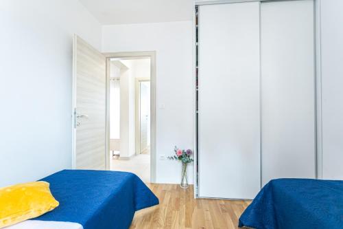 Postel nebo postele na pokoji v ubytování PALM BEACH