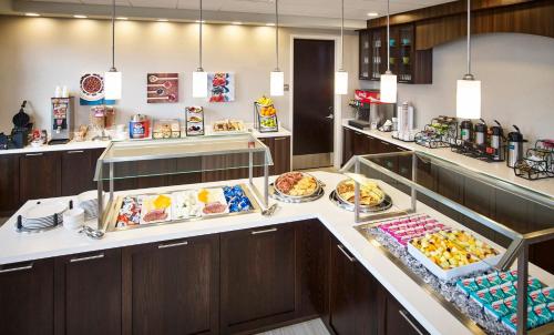 a kitchen filled with lots of different types of food at Staybridge Suites - Niagara-On-The-Lake, an IHG Hotel in Niagara-on-the-Lake