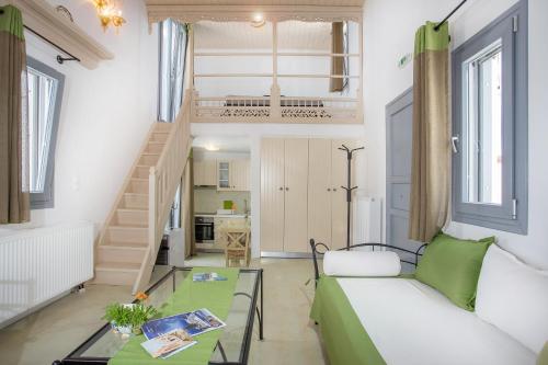 a living room with a couch and a table at Ianthi Boutique Guesthouses Skyros in Skiros