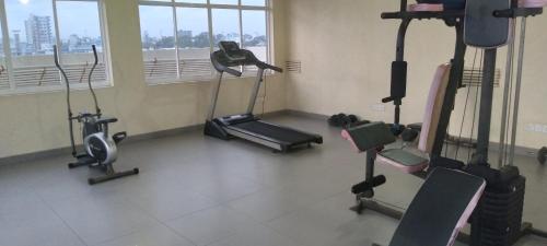 a gym with several exercise equipment in a room at Dominic's best in Mount Lavinia