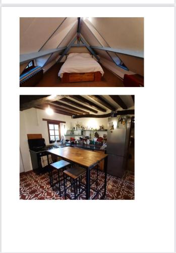 a bedroom and a dining room with a bed and a table at Chaleureuse chaumière proche Château et plages in Pleine-sève