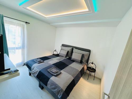 เตียงในห้องที่ Villa Szófia Veszprém apartments