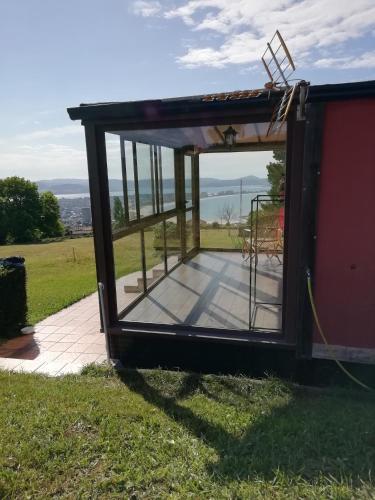 a screened in porch on the side of a house at Bungalow in Laredo