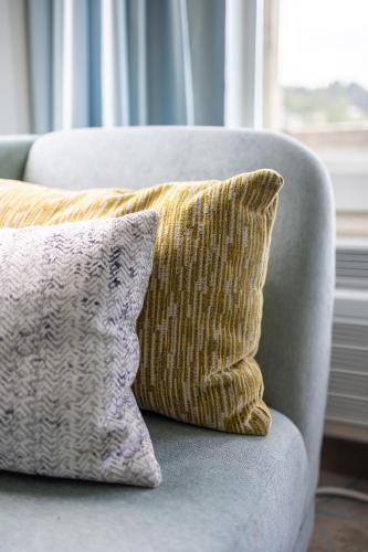 a pillow sitting on a couch in a living room at Jot's Resort in Gold Beach