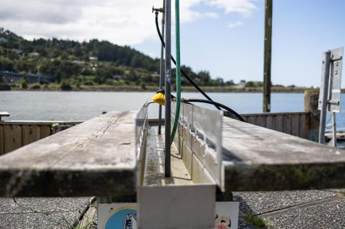a dock with a view of a body of water at Jot's Resort in Gold Beach