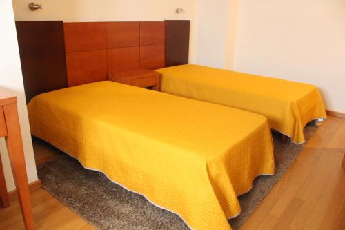 Ένα ή περισσότερα κρεβάτια σε δωμάτιο στο Guesthouse Muralhas do Mino