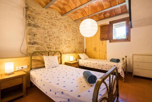 a bedroom with two beds in a room at La Granera in Girona
