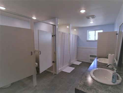a bathroom with two sinks and a shower at The Abbey in Leadville
