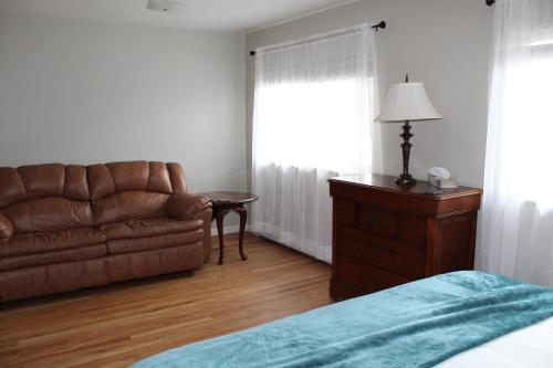 a living room with a couch and a table at The Abbey in Leadville