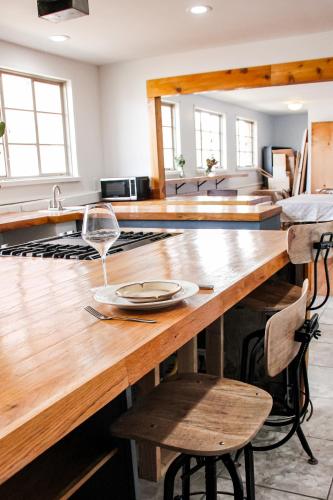a kitchen with a wooden table with a plate on it at The Abbey in Leadville