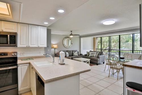 a kitchen and living room with a couch and a table at Midnight Cove II 823 in Siesta Key