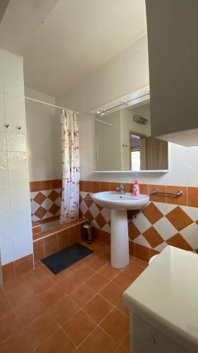 a bathroom with a sink and a mirror at VILLA HOLIDAY in Banjole