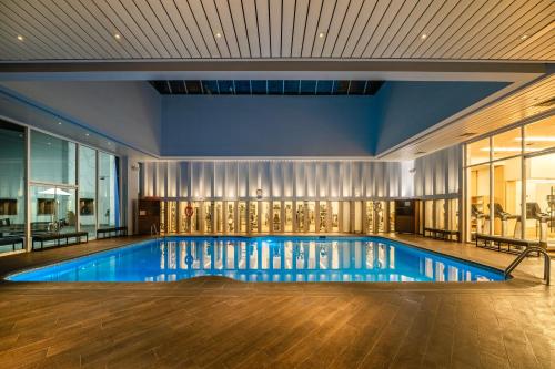 a swimming pool with blue water in a building at Hyatt Regency Mexico City in Mexico City