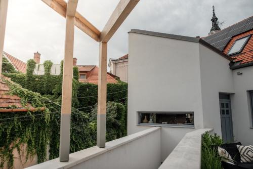 a view from the balcony of a house with white walls at Loftlakásom**** in Veszprém