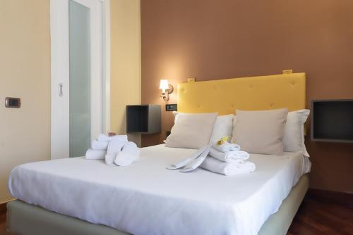 Postel nebo postele na pokoji v ubytování Hotel Suite Ares