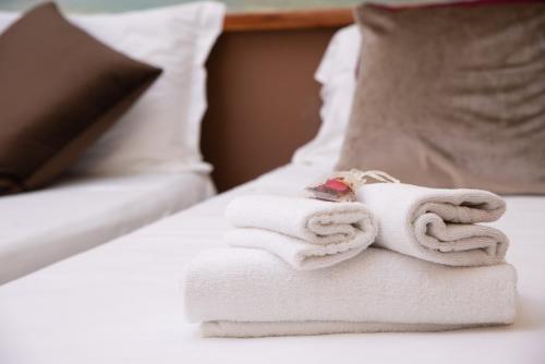 Postel nebo postele na pokoji v ubytování Hotel Suite Ares