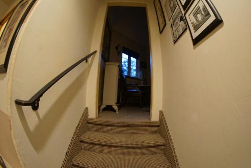 a staircase in a house with a stair case at FLEUR DE LAC EUROPERAN INn in Lake Arrowhead
