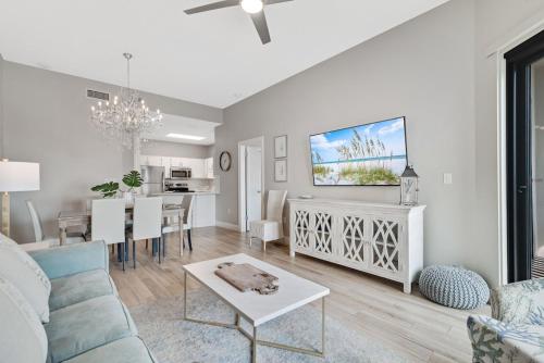 a living room with a couch and a table at Phoenix 6 Unit 114 in Orange Beach