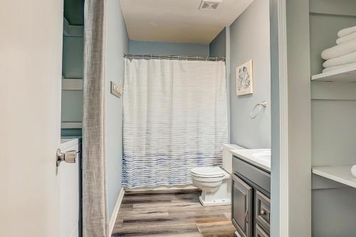 a bathroom with a toilet and a shower at In Spite of Ourselves in Edisto Beach