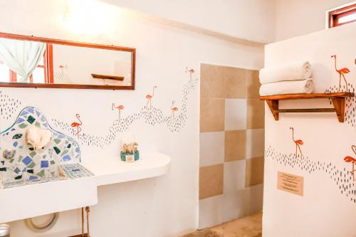 a bathroom with a sink and a mirror at Zomay Beachfront Holbox in Holbox Island