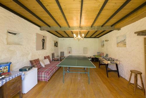 a living room with a table and a couch at Strone House in Helensburgh