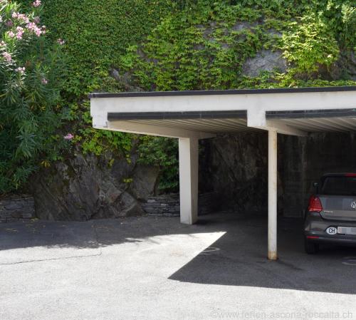 a parking lot with a car parked in it at Casa Roccalta in Ascona